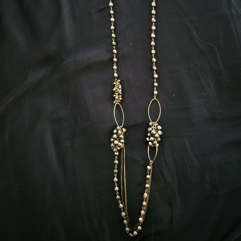 Long necklace in goldtone with silver beads accent